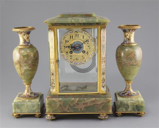 An early 20th century French ormolu mounted green onyx clock garniture, 12.25in.